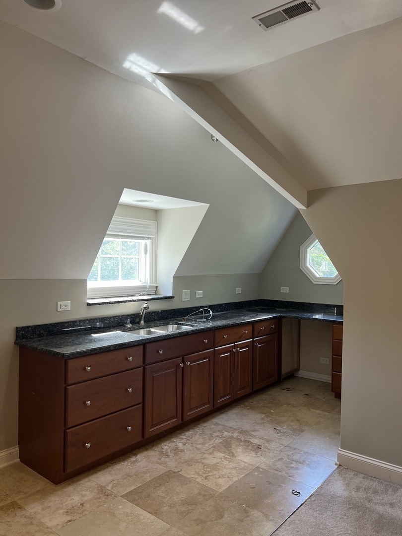 105 Fuller Road Hinsdale, IL 60521 - Photo 38 of 57 a large bathroom with a sink and a large mirror