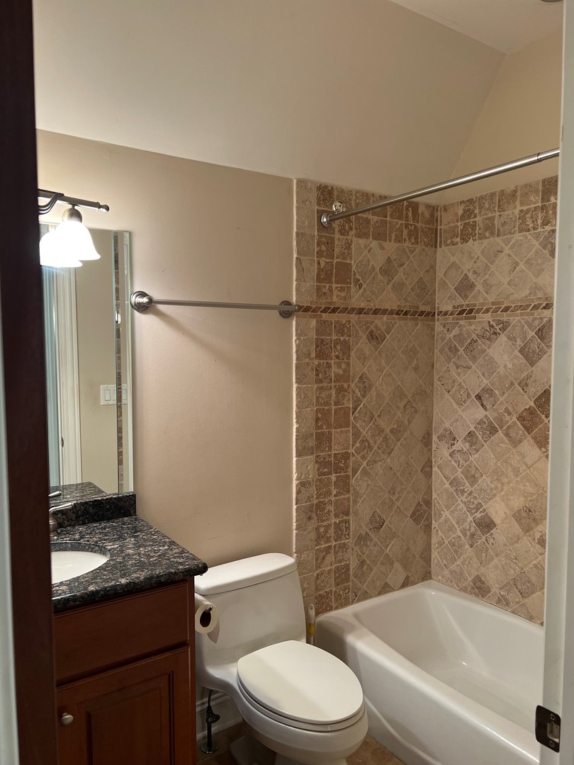 105 Fuller Road Hinsdale, IL 60521 - Photo 39 of 57 a bathroom with a granite countertop bathtub shower sink vanity and toilet