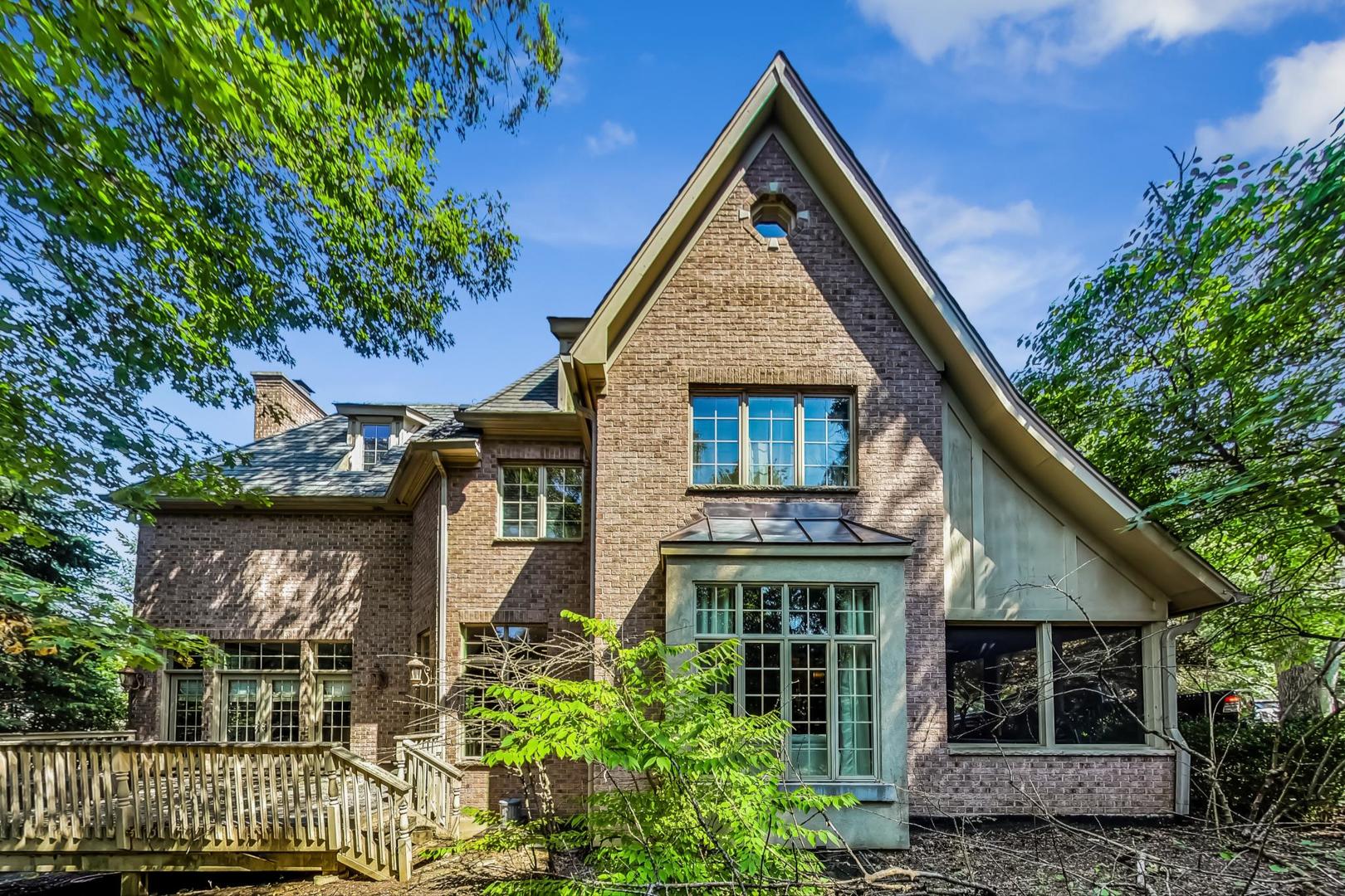 105 Fuller Road Hinsdale, IL 60521 - Photo 52 of 57 a front view of a house with a yard