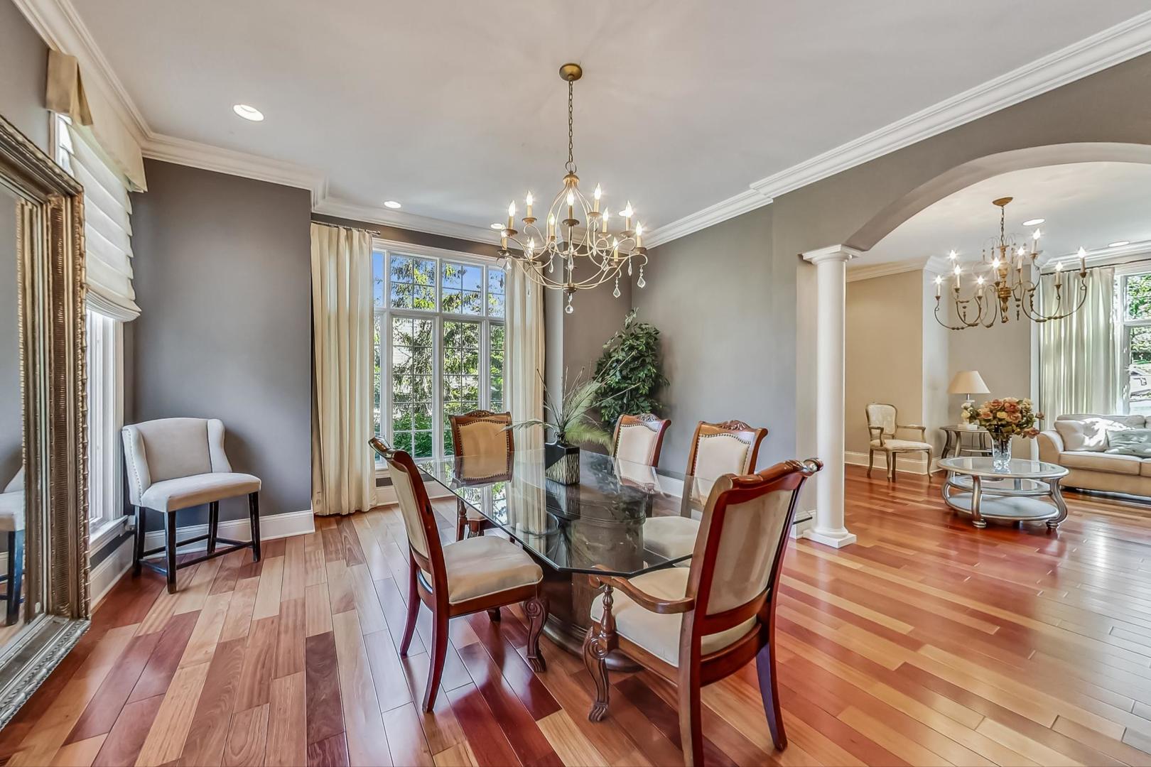 105 Fuller Road Hinsdale, IL 60521 - Photo 10 of 57 a view of a dining room with furniture window and wooden floor