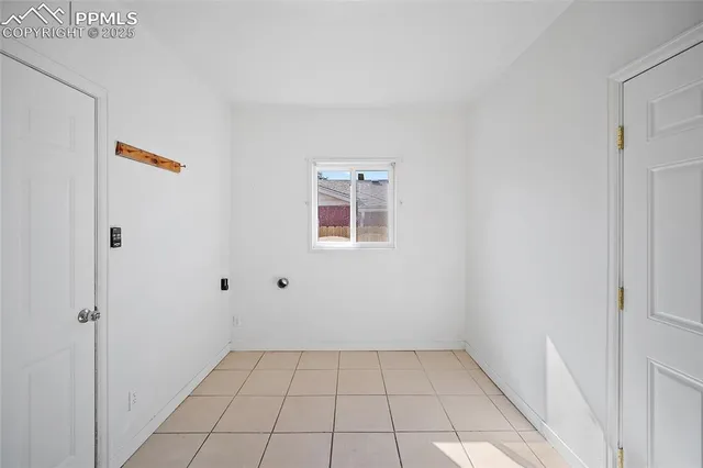 a view of an empty room with a window