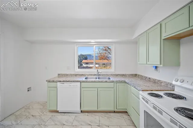 a kitchen with a sink stove and cabinets