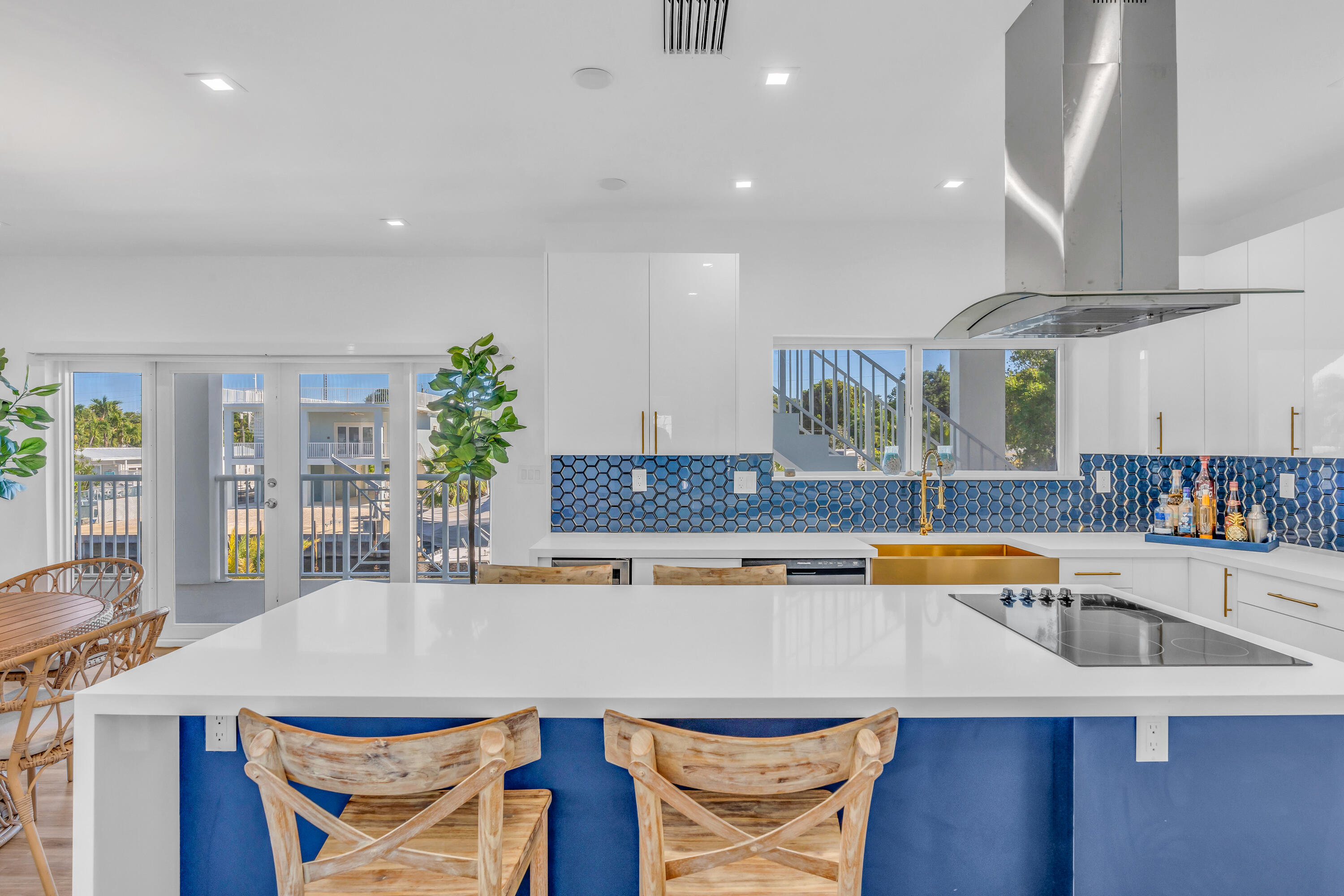 229 Upper Matecumbe Road Key Largo, FL 33037 - Photo 13 of 77 a kitchen with stainless steel appliances granite countertop a sink a stove and a refrigerator