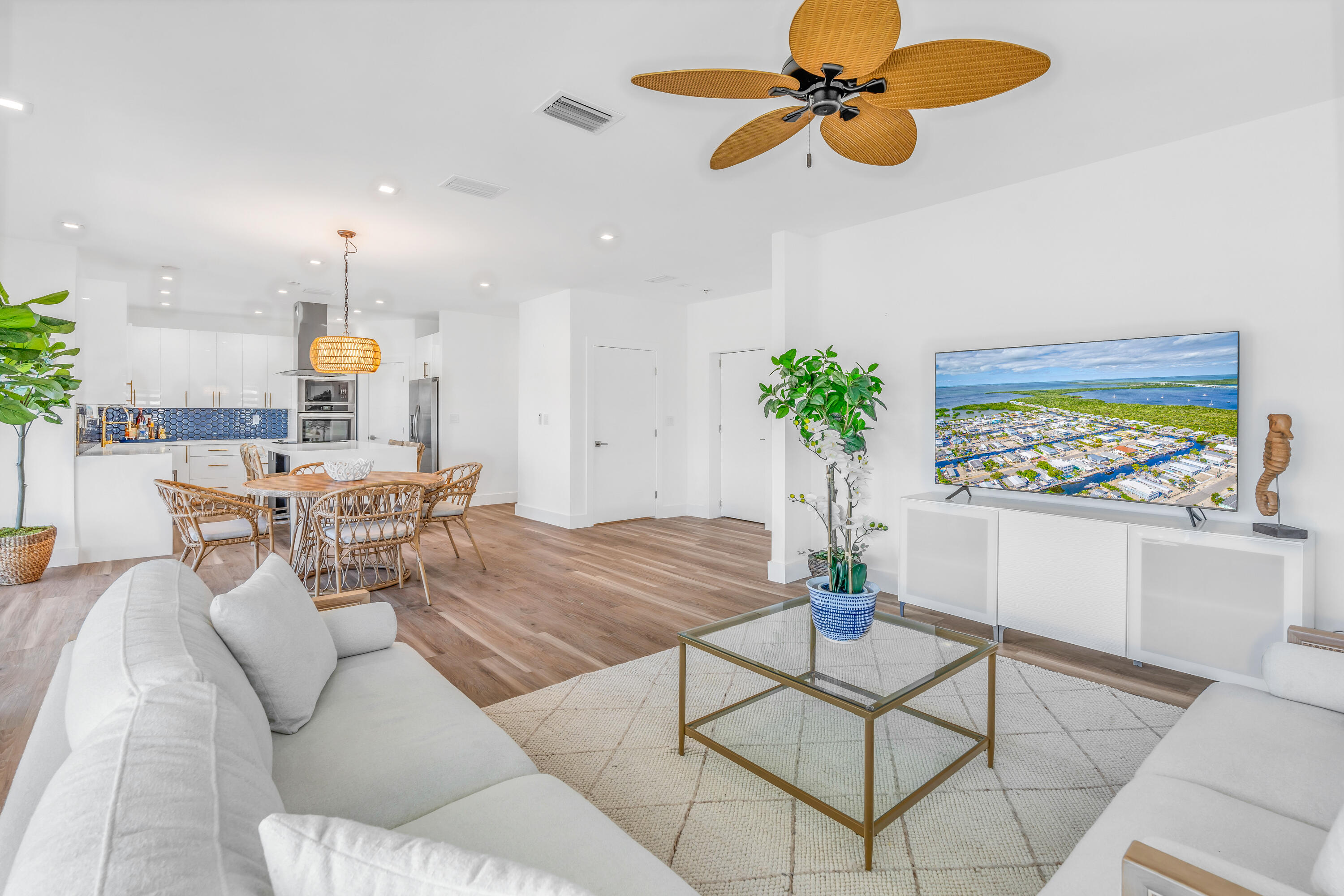 229 Upper Matecumbe Road Key Largo, FL 33037 - Photo 14 of 77 a living room with furniture and a chandelier