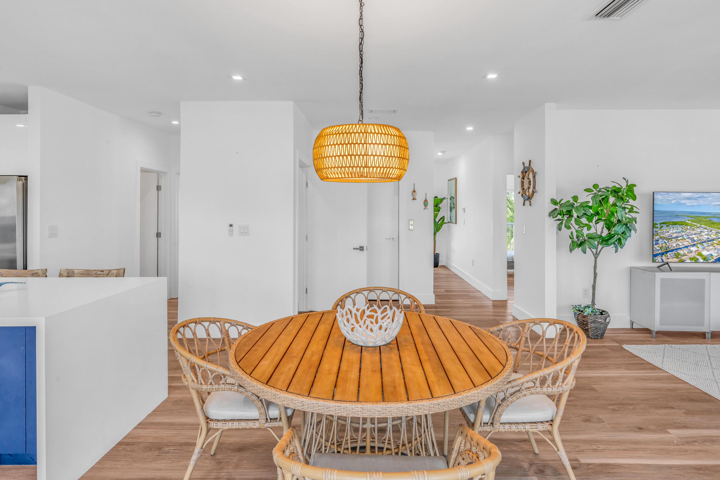 229 Upper Matecumbe Road Key Largo, FL 33037 - Photo 15 of 77 a view of a dining room with furniture and wooden floor
