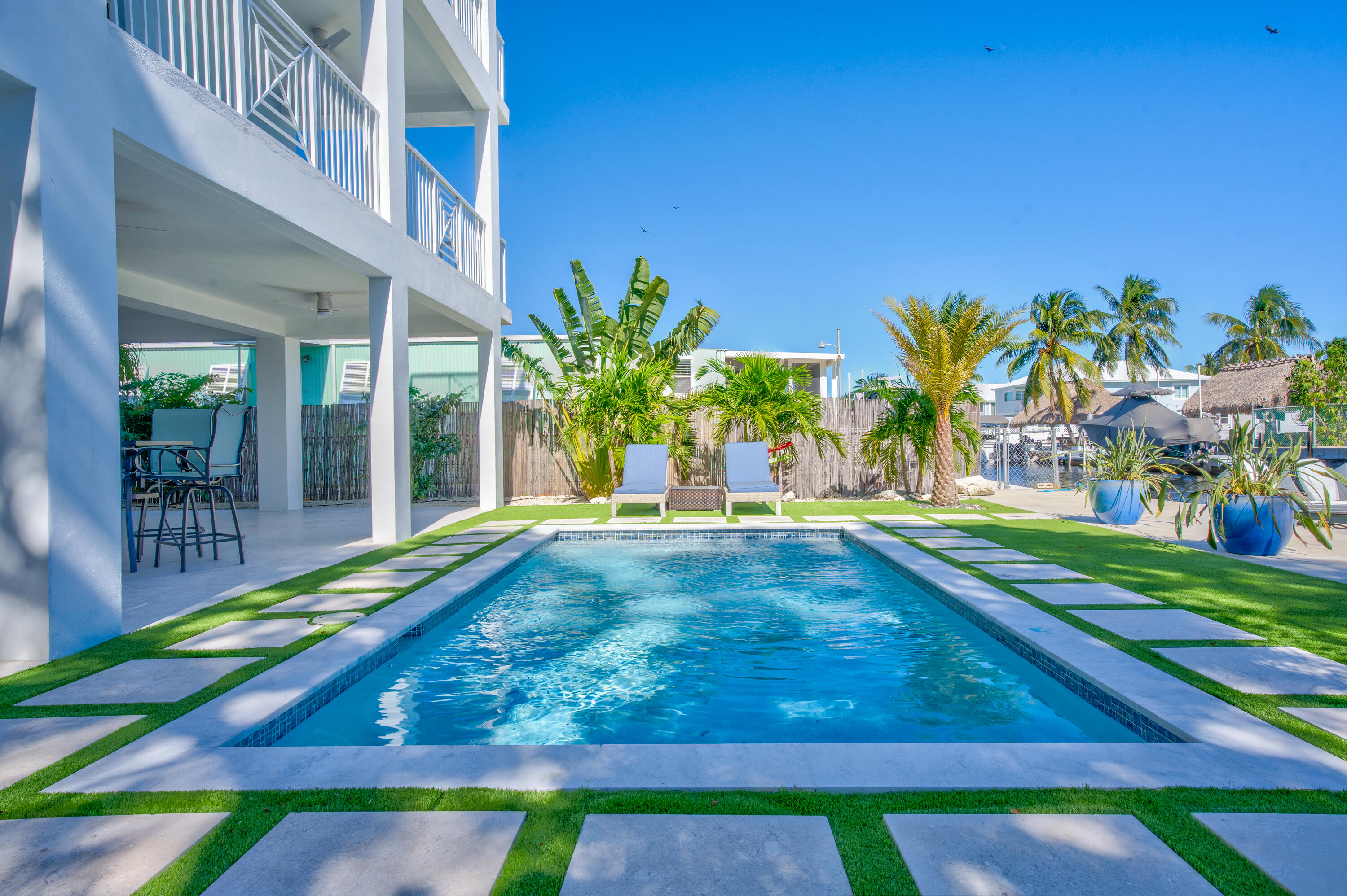 229 Upper Matecumbe Road Key Largo, FL 33037 - Photo 2 of 77 a view of an swimming pool with an outdoor space