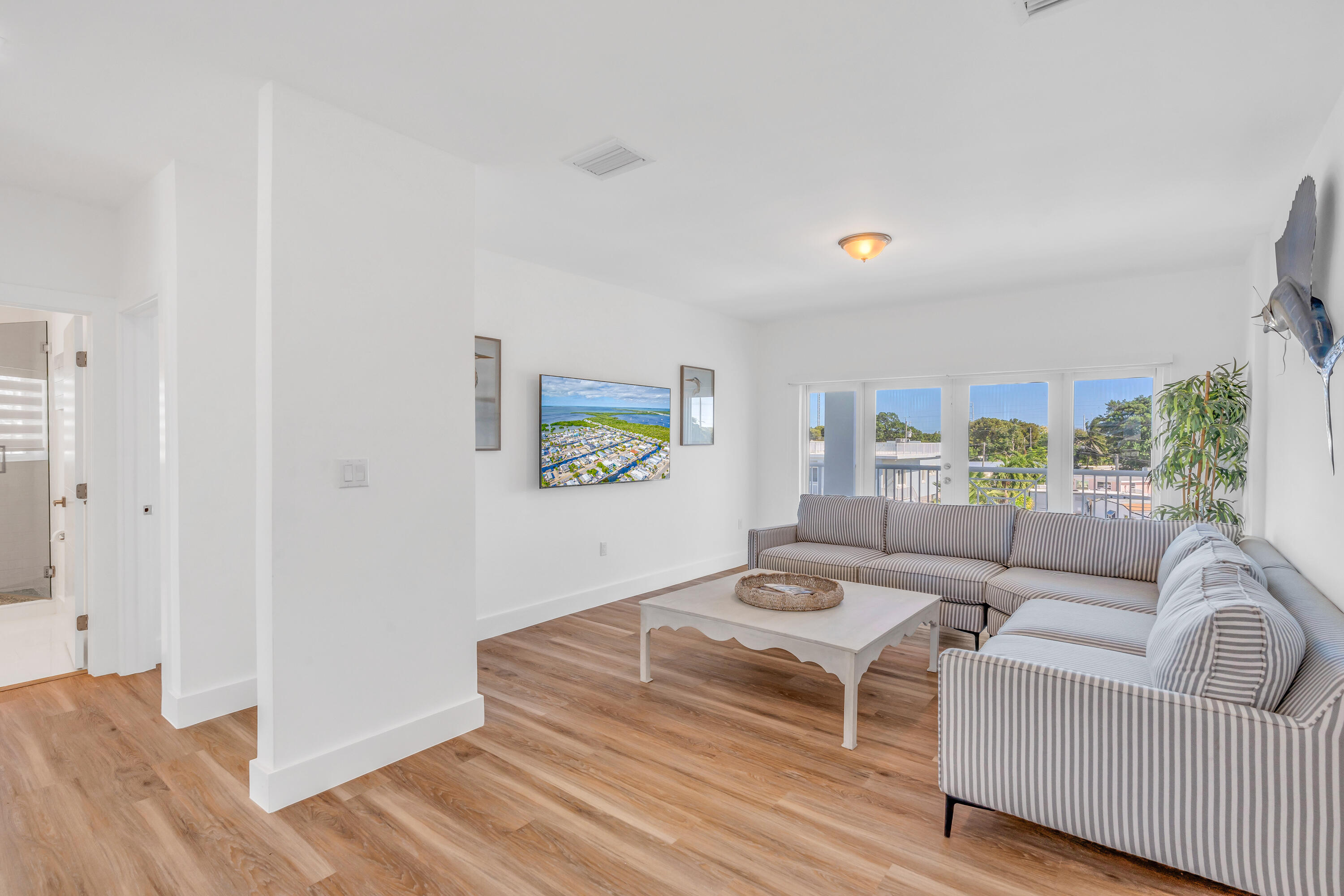 229 Upper Matecumbe Road Key Largo, FL 33037 - Photo 21 of 77 a living room with furniture and a hard wood floor