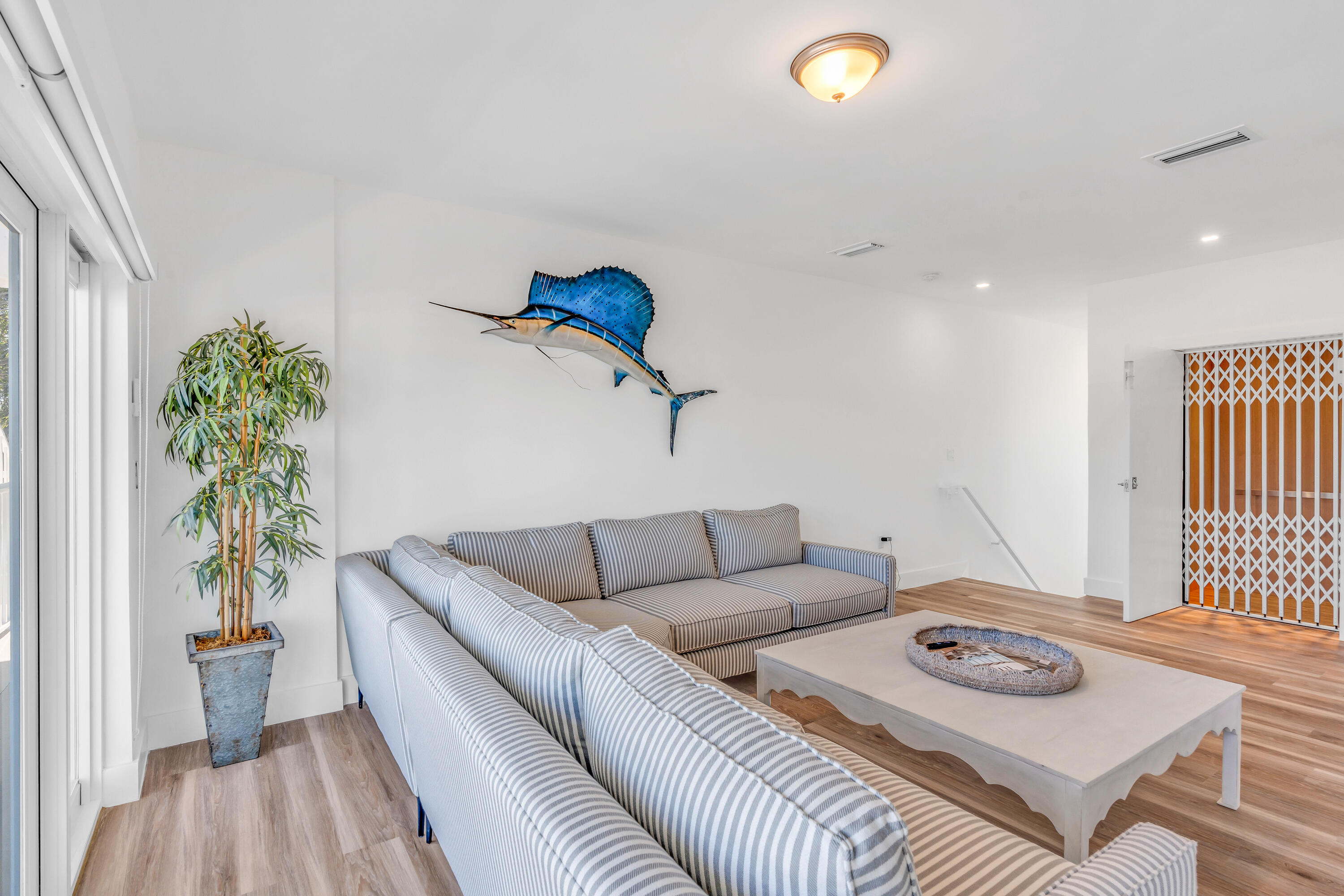 229 Upper Matecumbe Road Key Largo, FL 33037 - Photo 22 of 77 a living room with furniture and a window