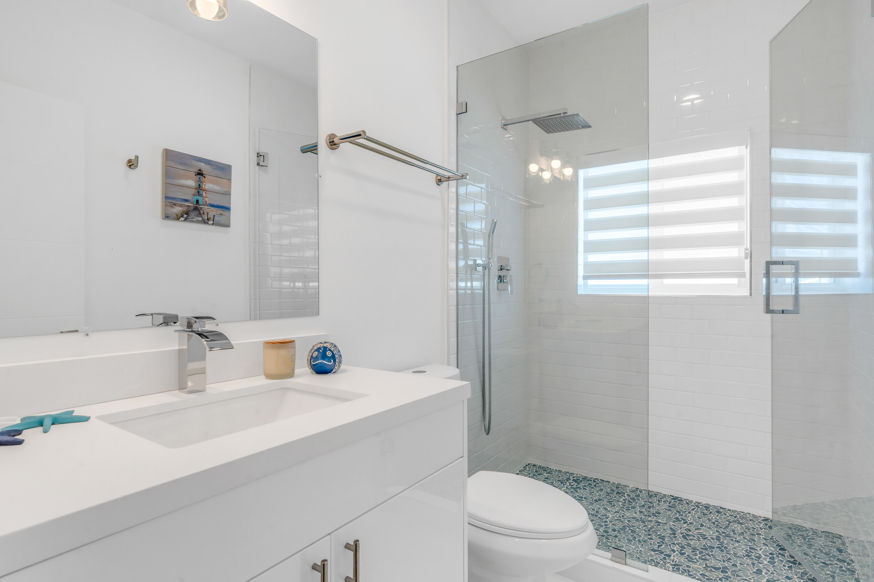 229 Upper Matecumbe Road Key Largo, FL 33037 - Photo 28 of 77 a bathroom with a sink a toilet and shower