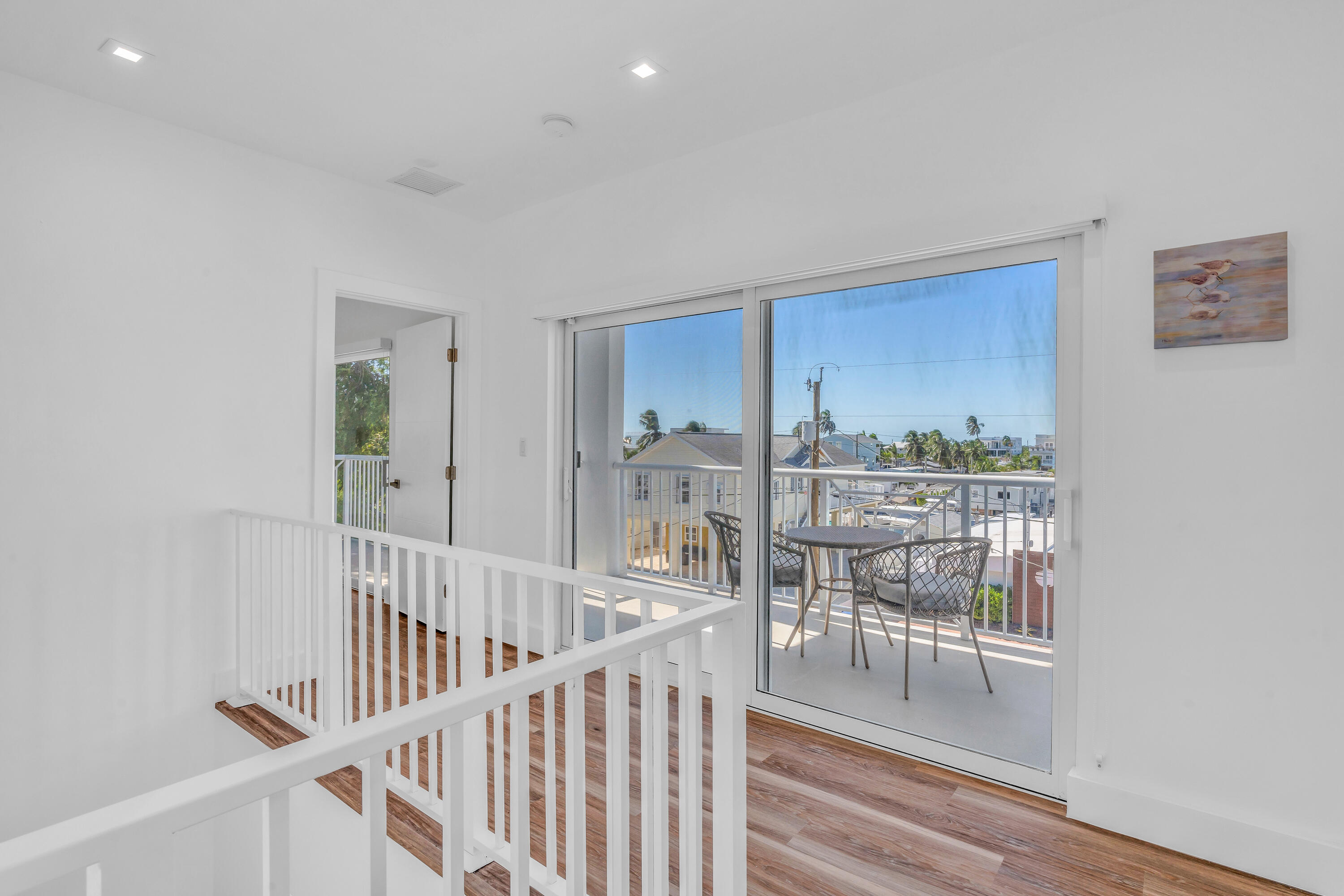229 Upper Matecumbe Road Key Largo, FL 33037 - Photo 35 of 77 a view of a room with wooden floor and windows