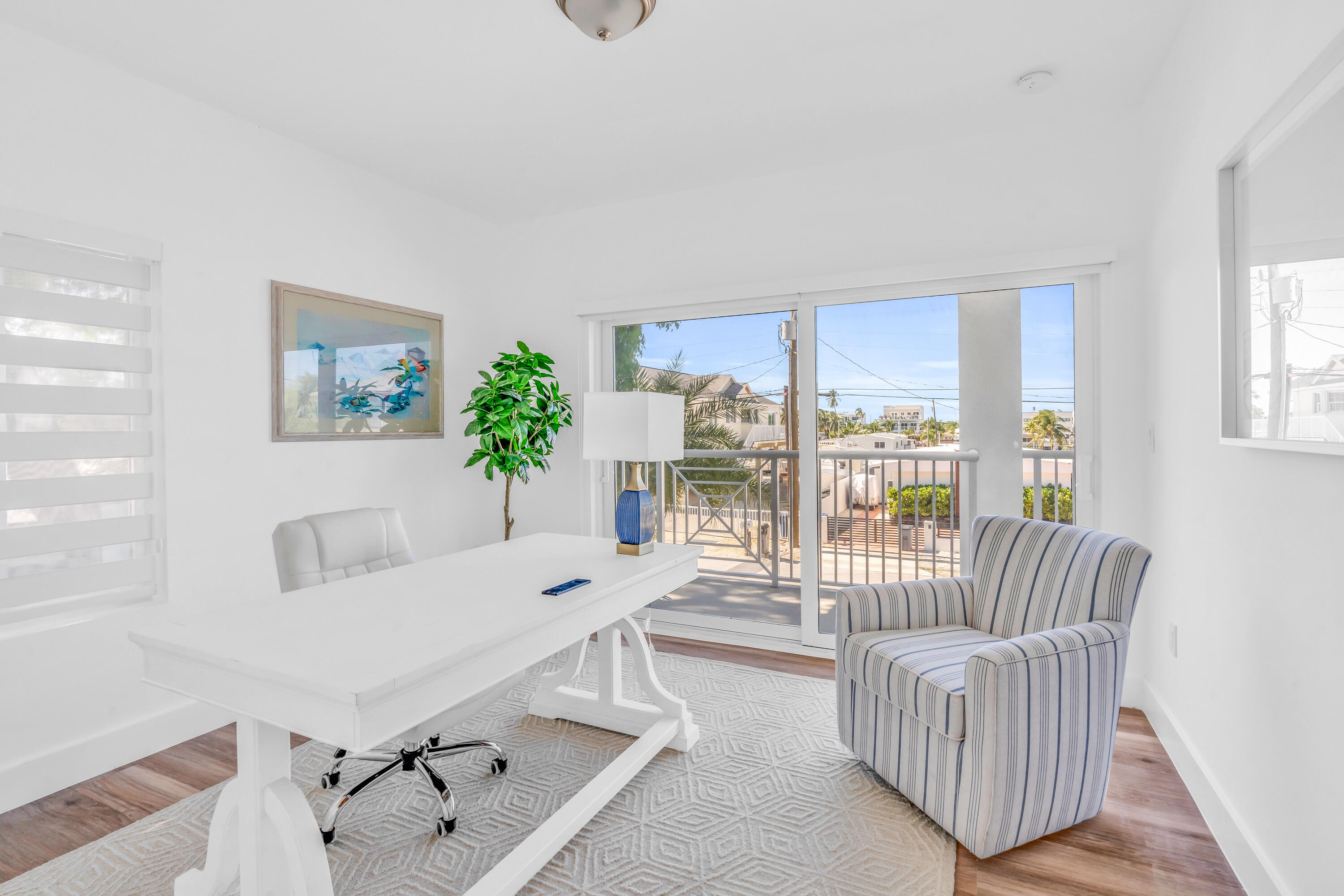 229 Upper Matecumbe Road Key Largo, FL 33037 - Photo 36 of 77 a living room with furniture and a large window