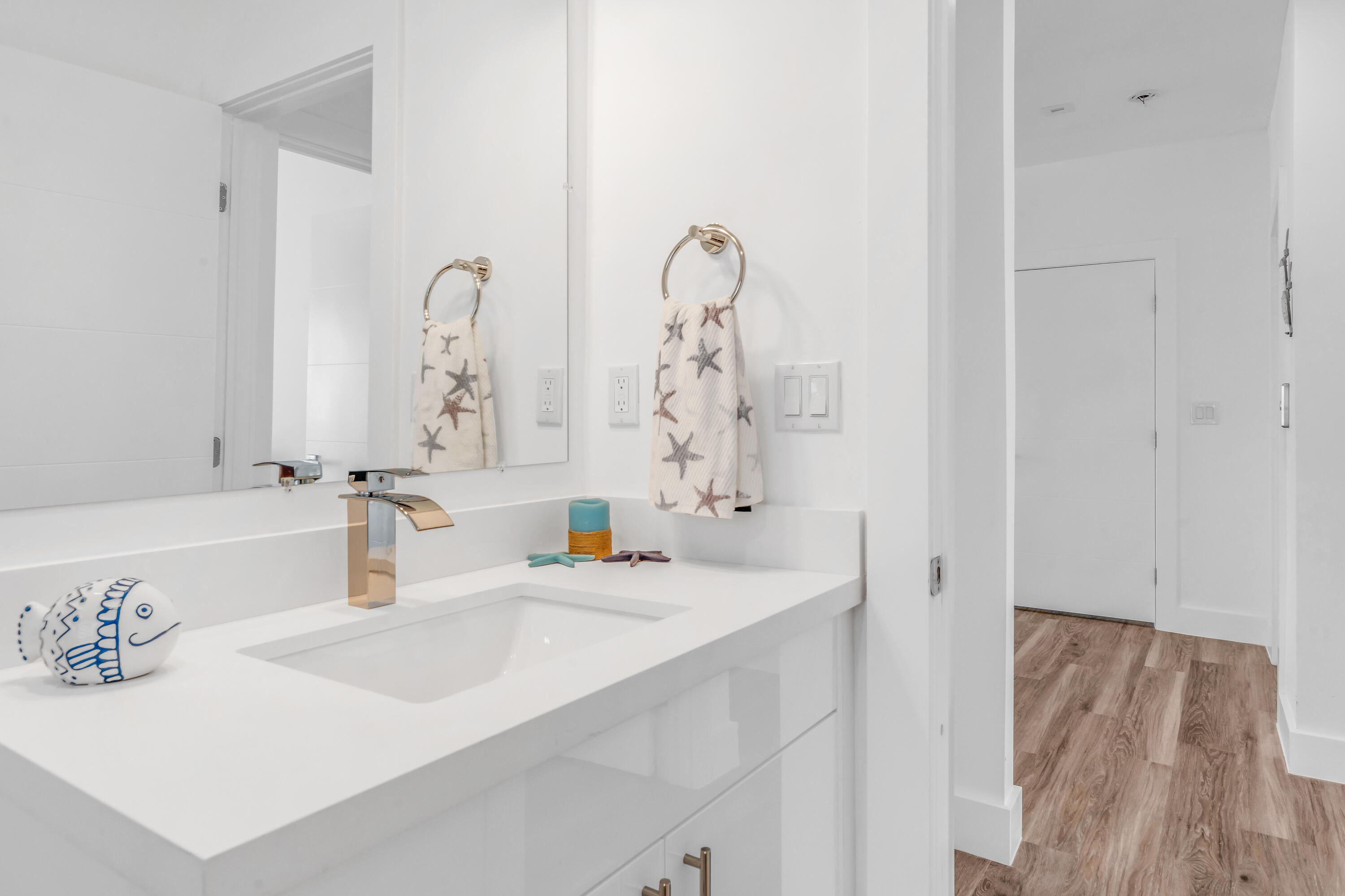 229 Upper Matecumbe Road Key Largo, FL 33037 - Photo 38 of 77 a bathroom with a sink and a mirror