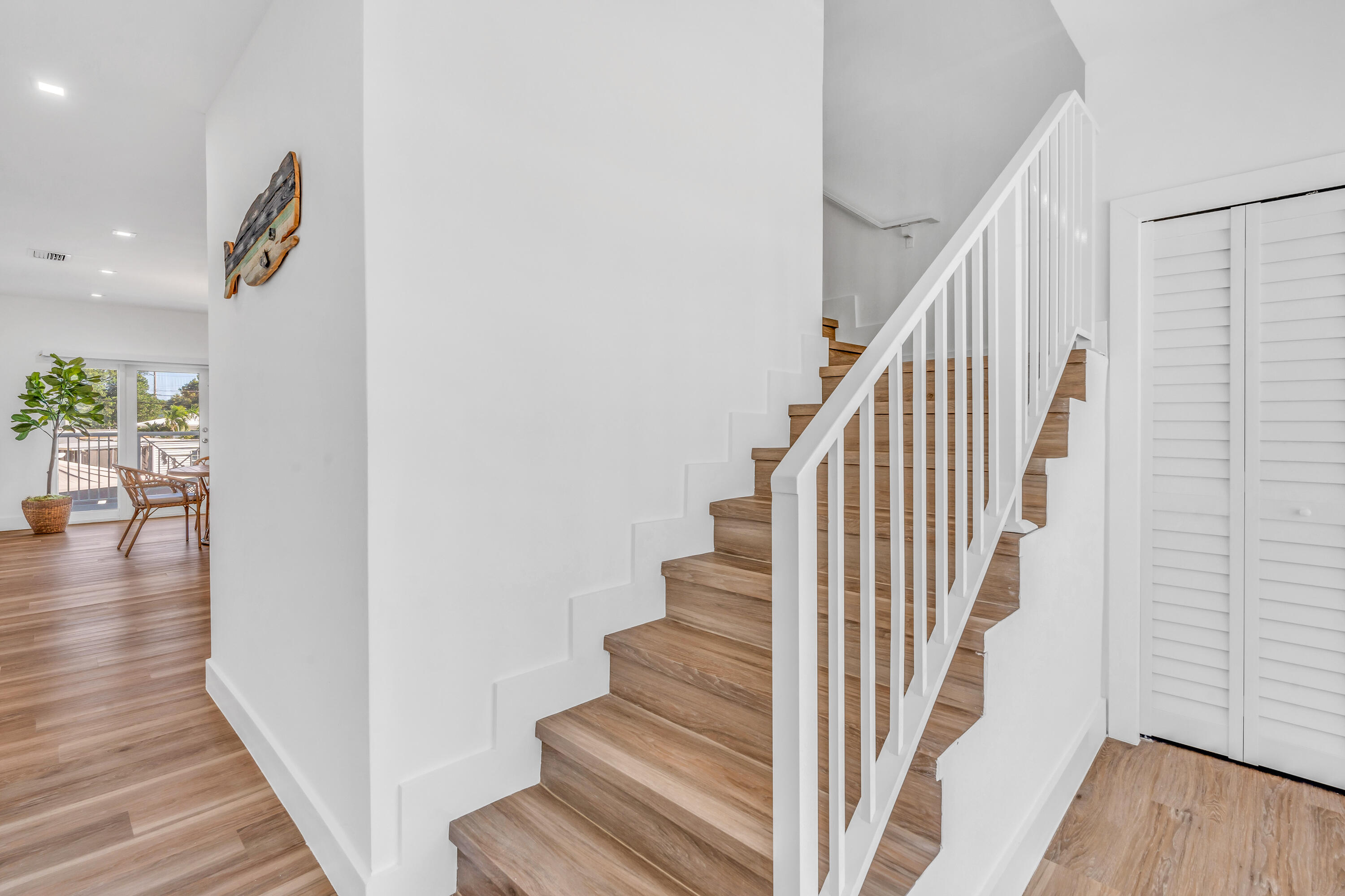 229 Upper Matecumbe Road Key Largo, FL 33037 - Photo 40 of 77 a view of entryway and hall with wooden floor
