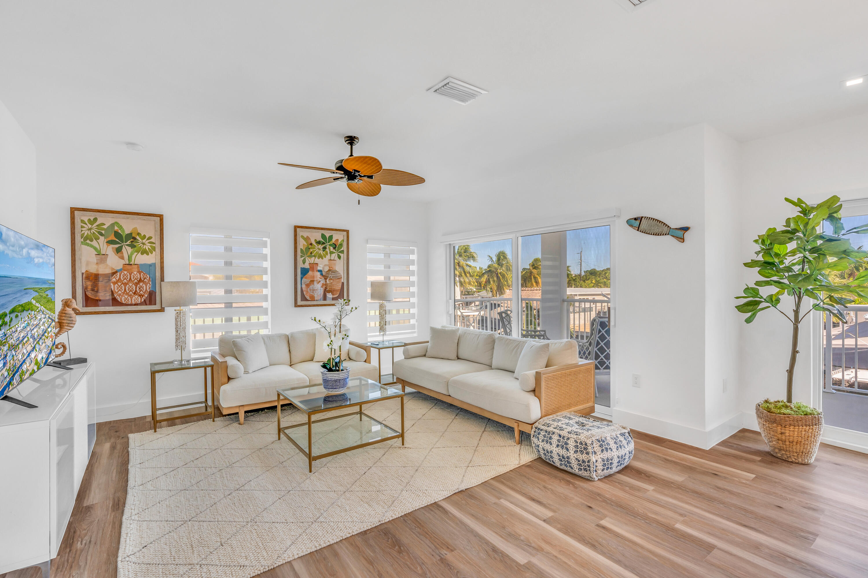 229 Upper Matecumbe Road Key Largo, FL 33037 - Photo 4 of 77 a living room with furniture and a potted plant
