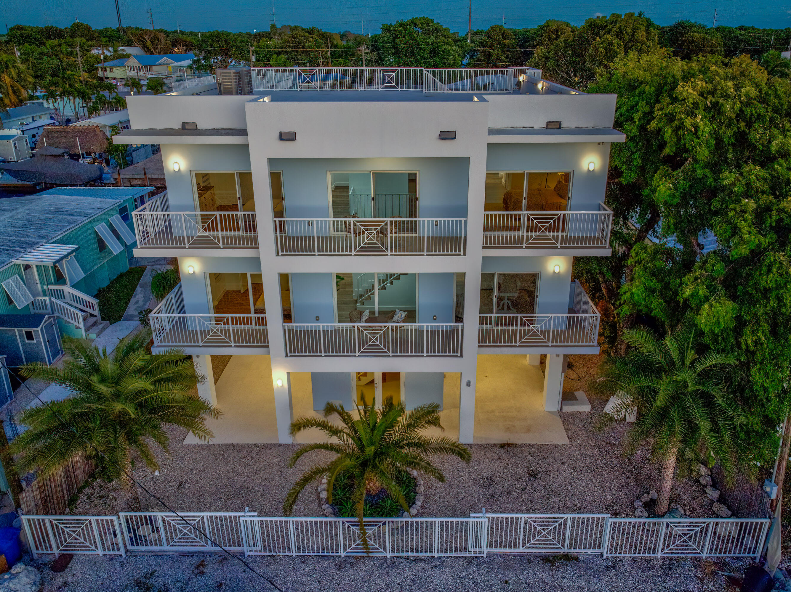 229 Upper Matecumbe Road Key Largo, FL 33037 - Photo 69 of 77 a view of a building with a garden and plants