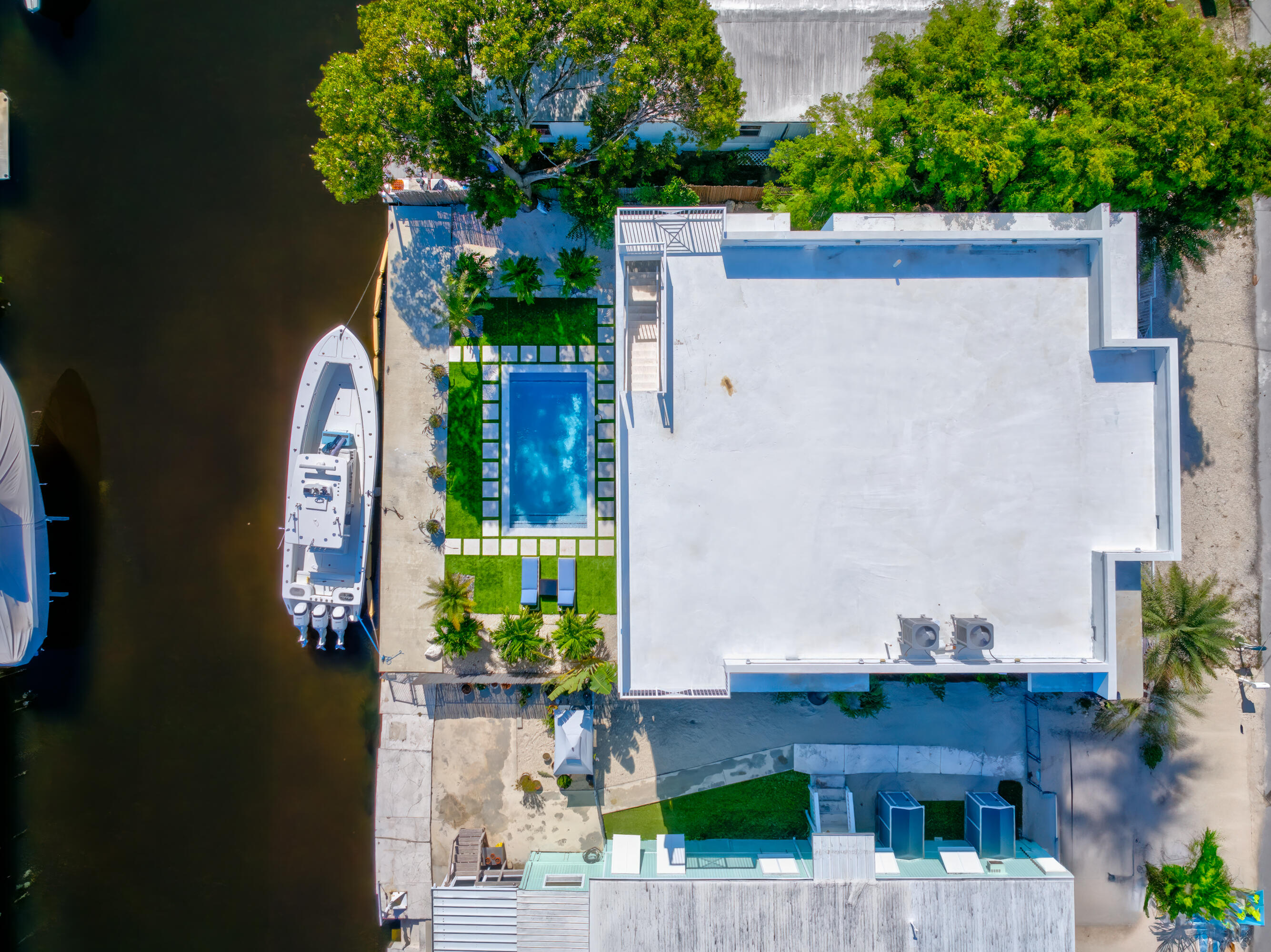 229 Upper Matecumbe Road Key Largo, FL 33037 - Photo 75 of 77 an aerial view of a house with a yard and potted plants