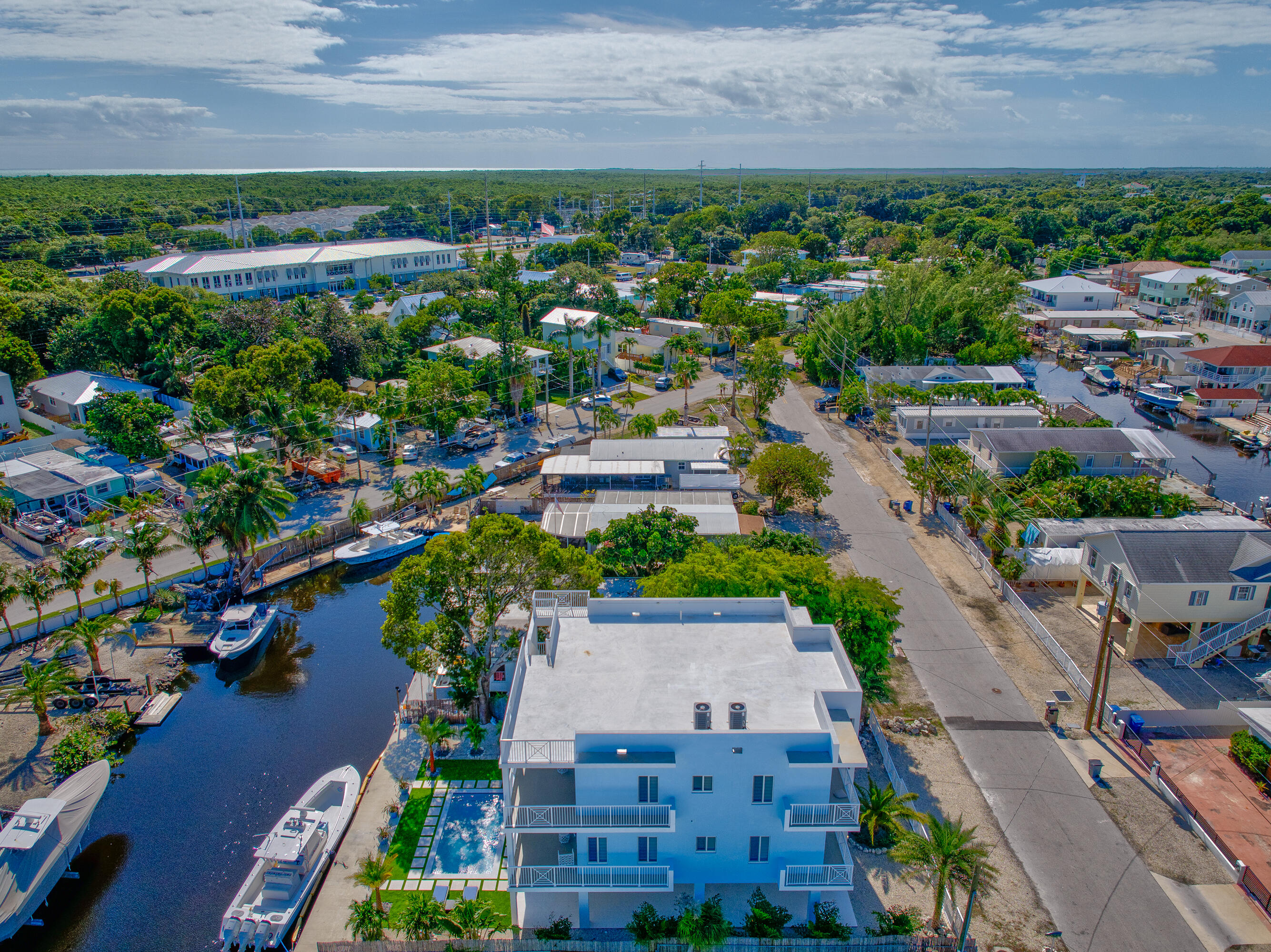 229 Upper Matecumbe Road Key Largo, FL 33037 - Photo 76 of 77 an aerial view of a house with a garden