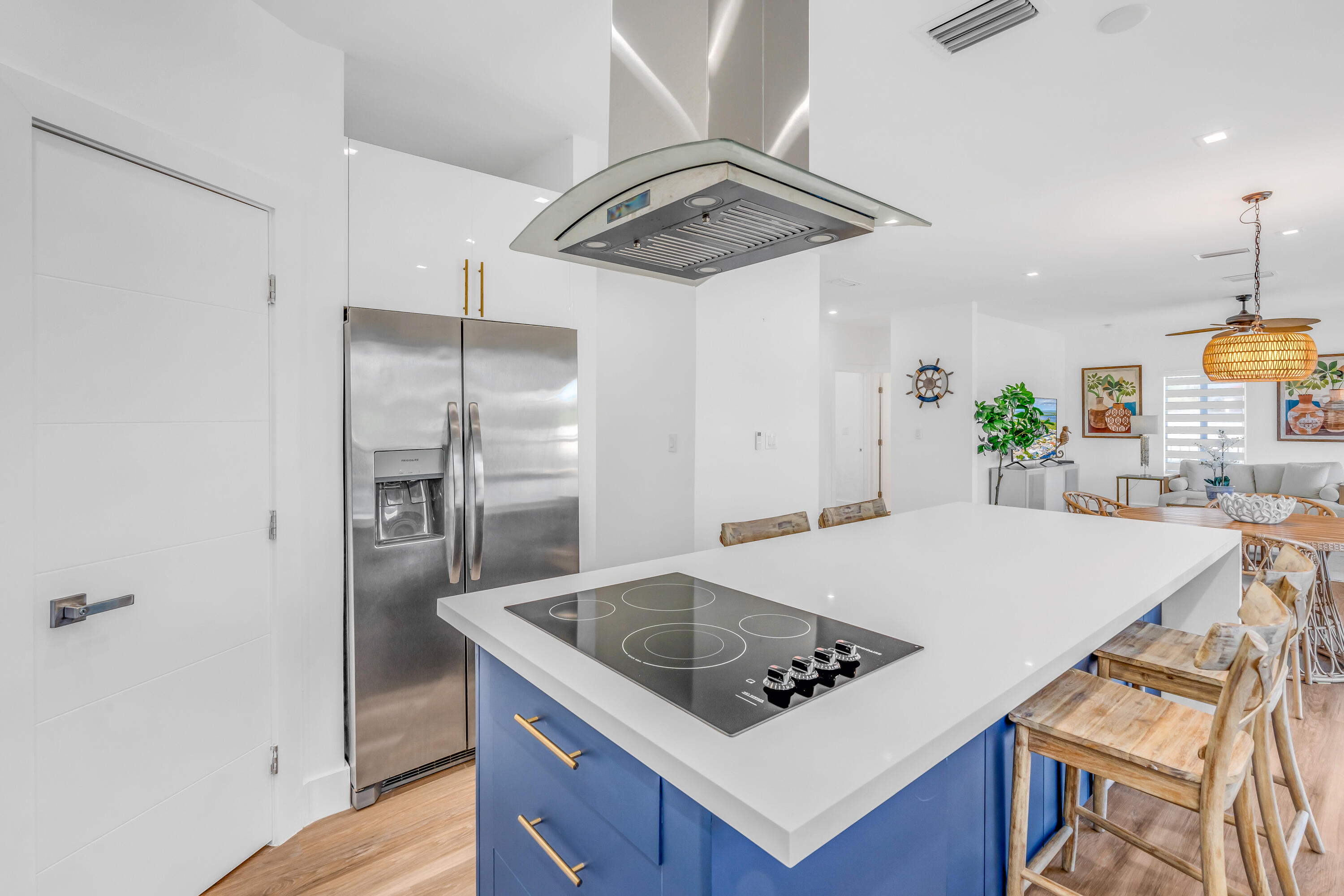 229 Upper Matecumbe Road Key Largo, FL 33037 - Photo 10 of 77 a kitchen with stainless steel appliances granite countertop a sink a stove a refrigerator a washer dryer and white cabinets