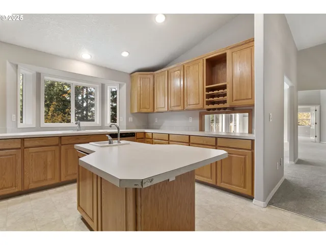 a kitchen with a stove a sink and a refrigerator