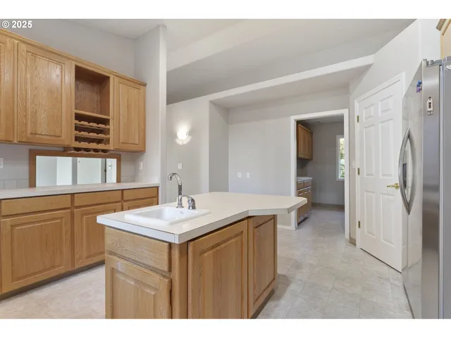 a kitchen with a sink cabinets and appliances
