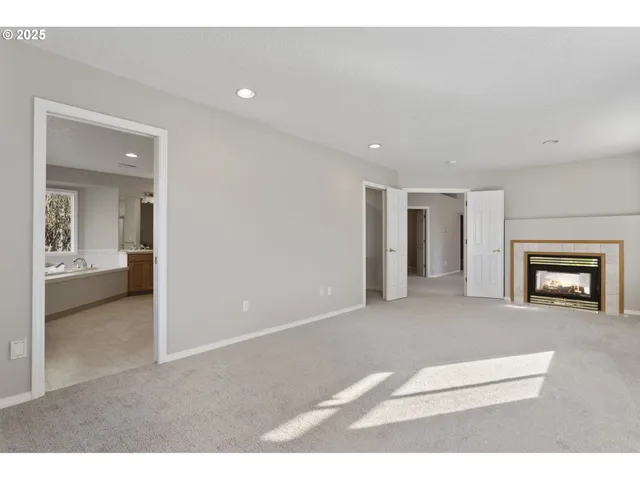 a living room with furniture and a balcony