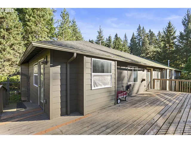a view of balcony with wooden floor and fence