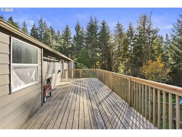 a view of balcony with wooden floor and outdoor seating