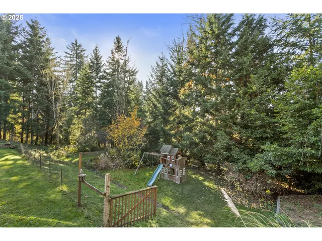 a balcony with trees in front of it