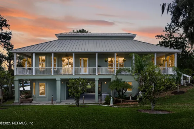 a view of a dining room with furniture wooden floor and front door