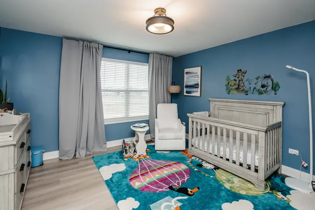 a bedroom with furniture and a window