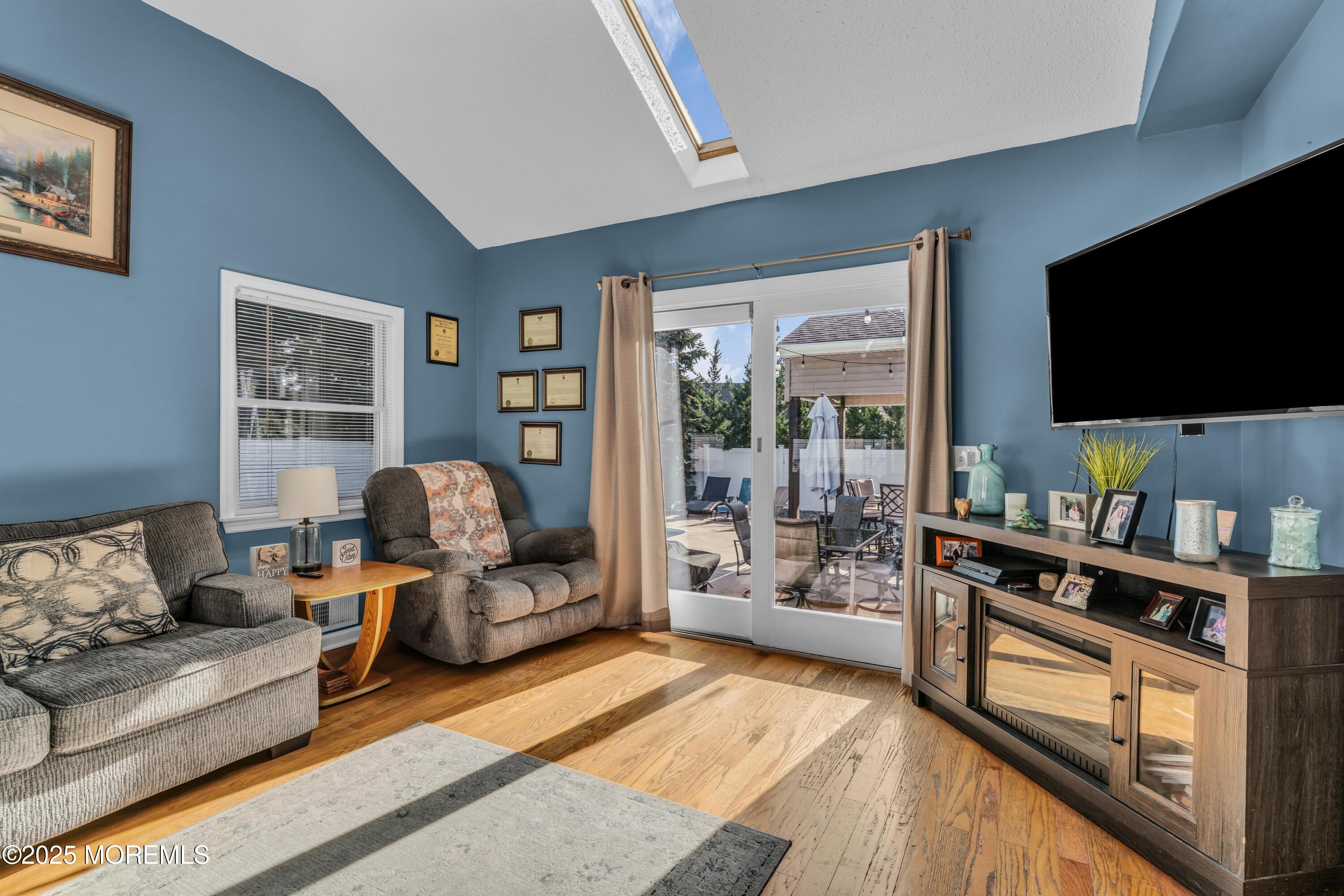 910 Alpine Street Forked River, NJ 08731 - Photo 13 of 32 a living room with furniture and a flat screen tv