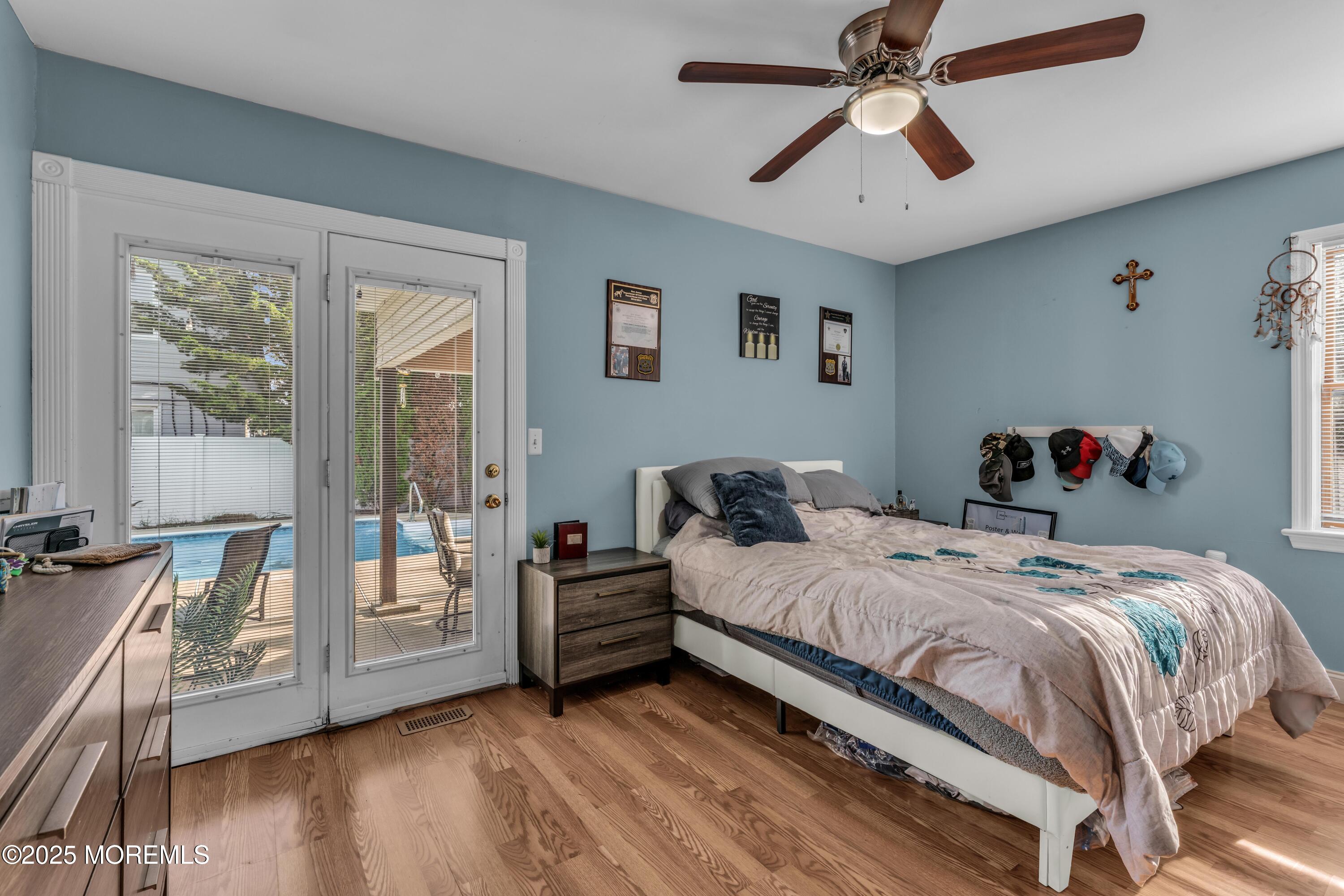 910 Alpine Street Forked River, NJ 08731 - Photo 16 of 32 a bedroom with a bed and wooden floor
