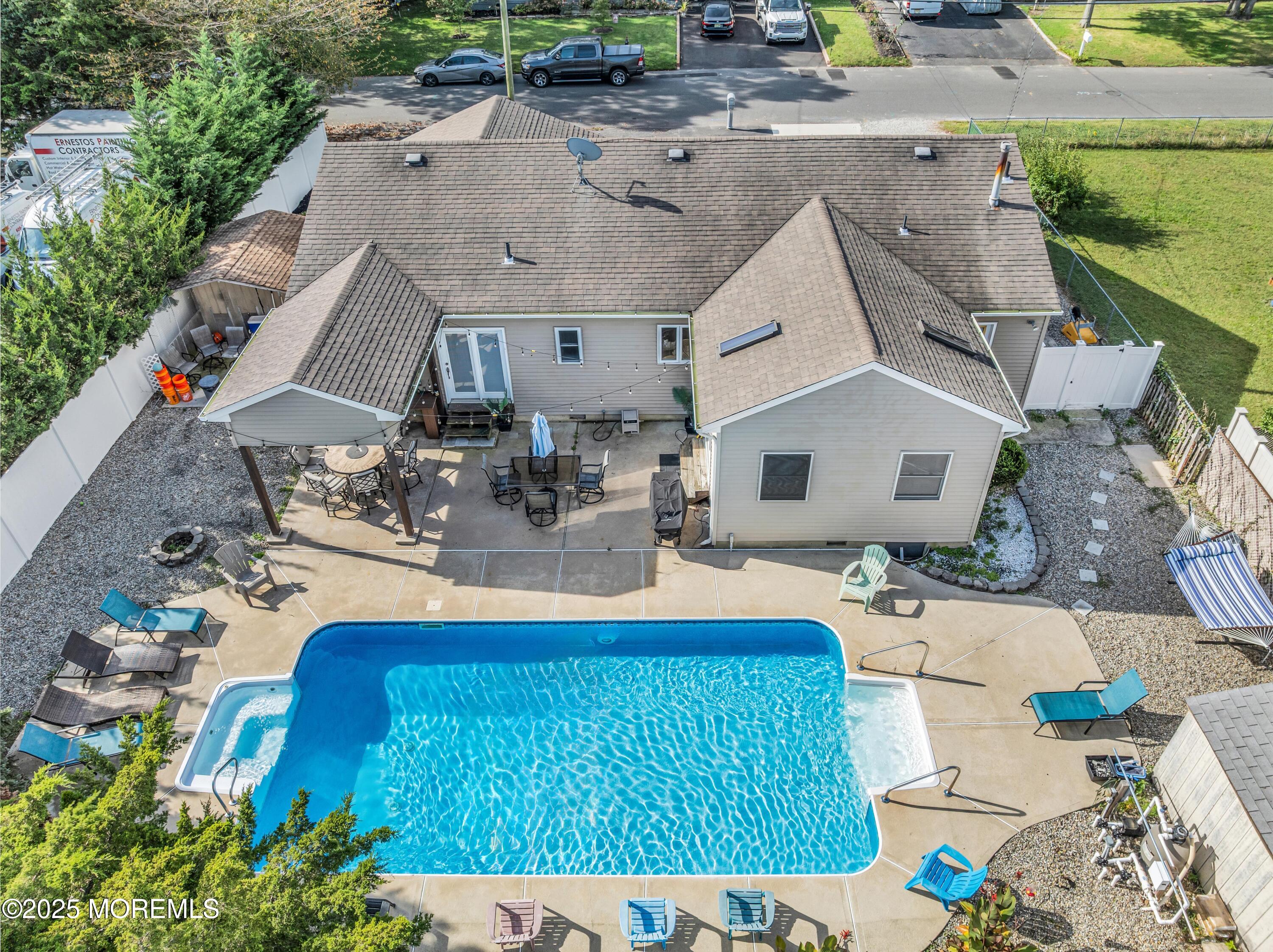 910 Alpine Street Forked River, NJ 08731 - Photo 21 of 32 an aerial view of a house with swimming pool and a yard