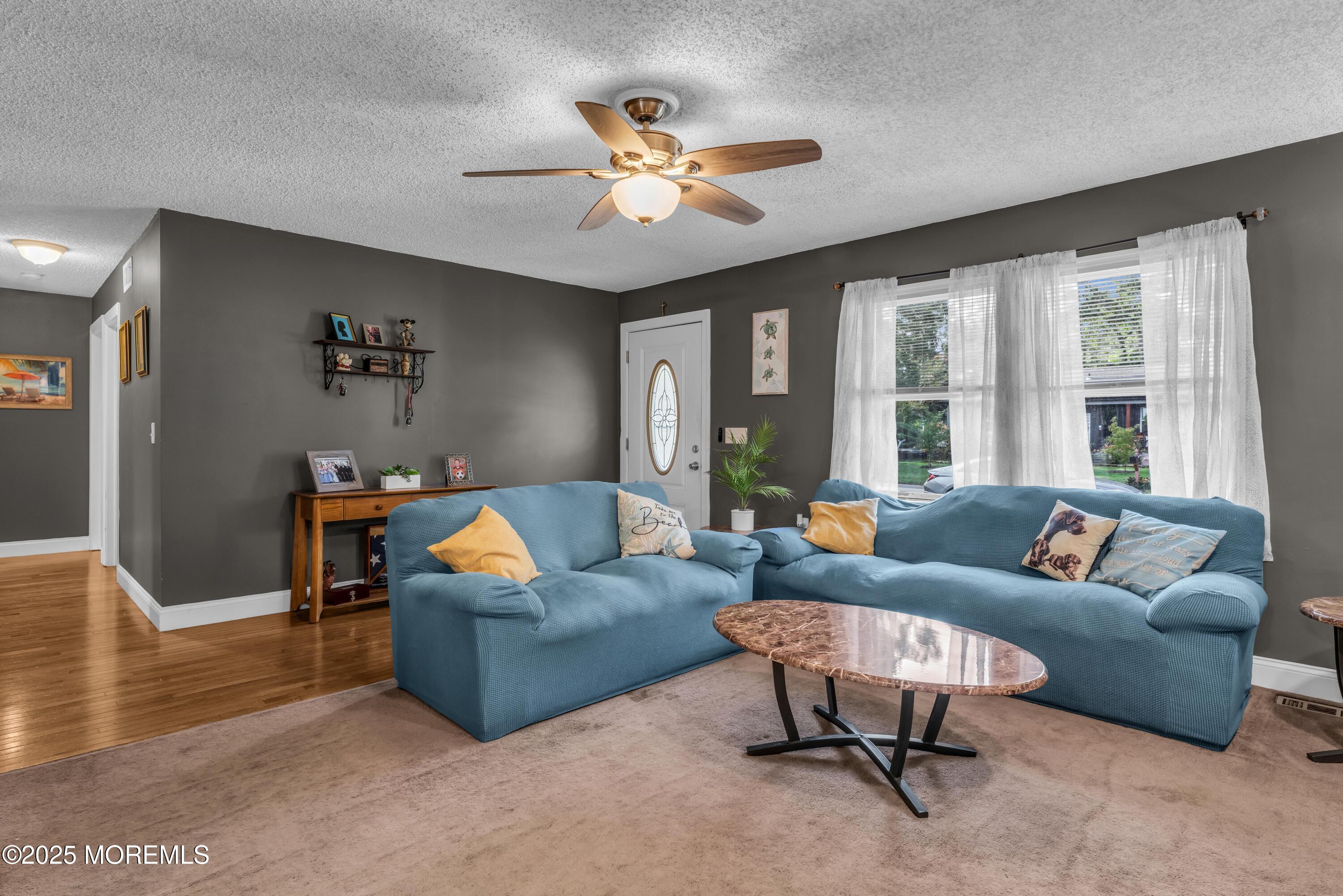 910 Alpine Street Forked River, NJ 08731 - Photo 6 of 32 a living room with furniture and a large window