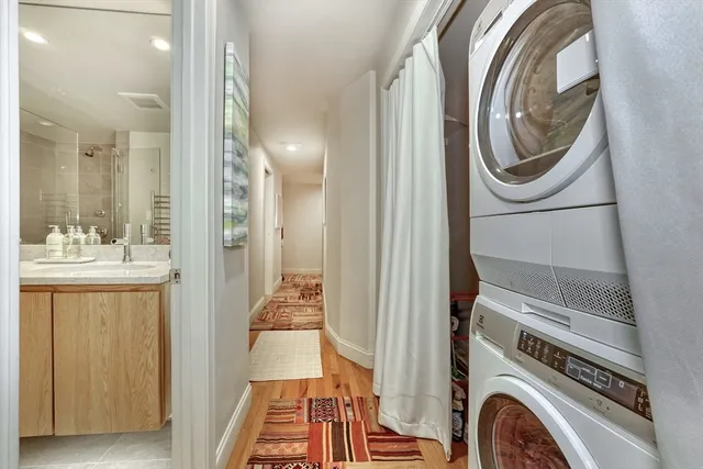 a bathroom with a sink a washer and dryer