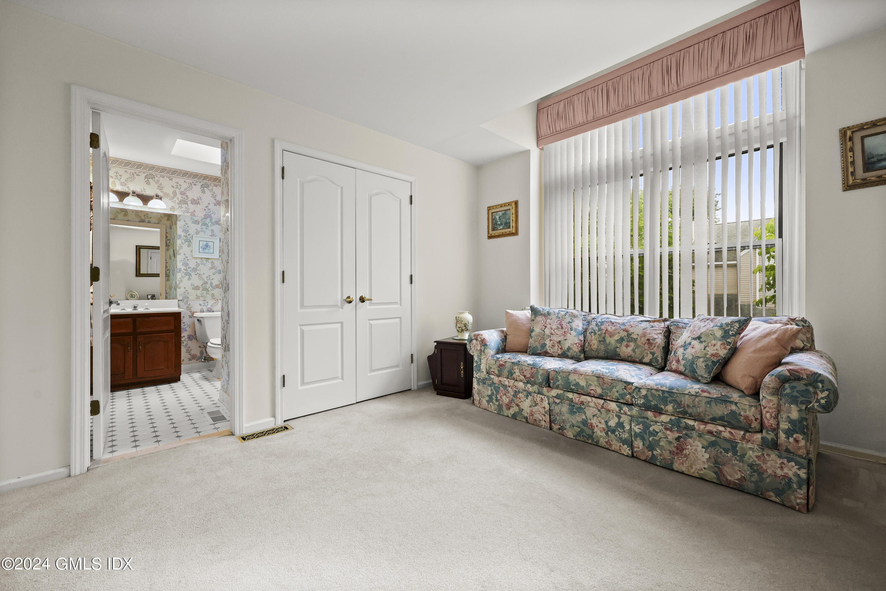 162 Colonial Road, Unit 12 Stamford, CT 06906 - Photo 30 of 38 a living room with furniture and large windows