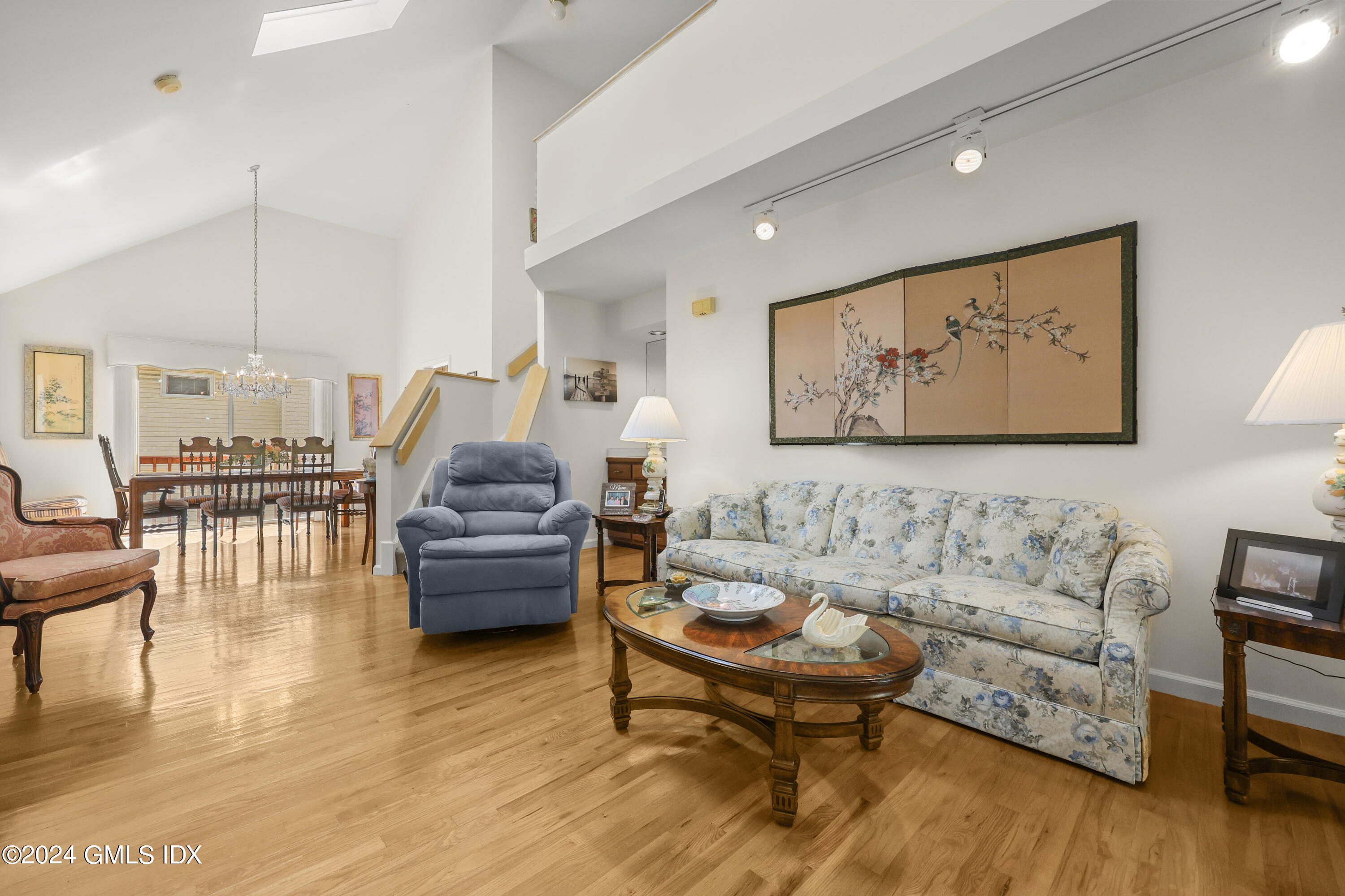 162 Colonial Road, Unit 12 Stamford, CT 06906 - Photo 3 of 38 a living room with furniture and wooden floor