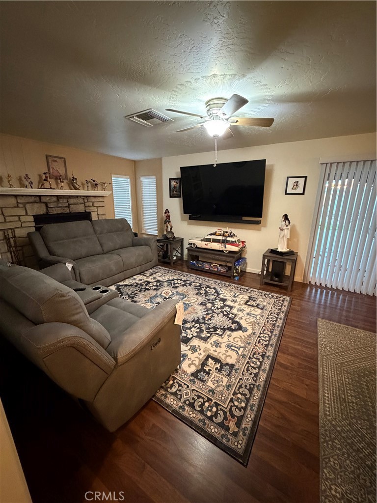 209 Kimberly Lane Ridgecrest, CA 93555 - Photo 23 of 62 a living room with furniture and a flat screen tv