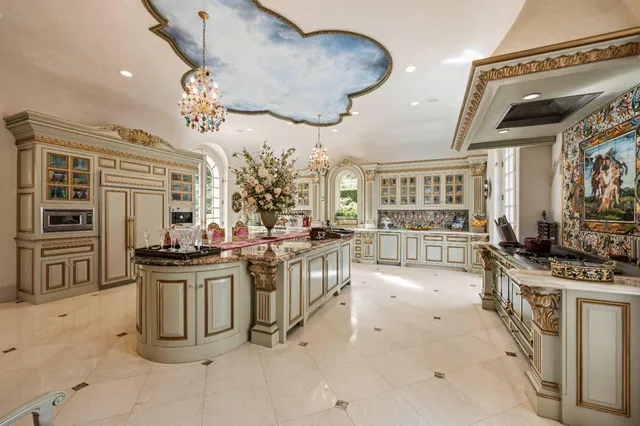 a spacious bathroom with a granite countertop sink a large mirror and a bathtub