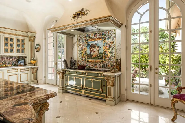a living room with fireplace furniture and a large window