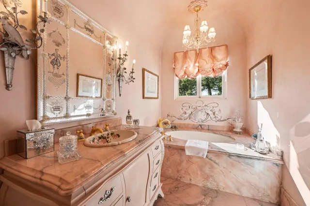 a kitchen with stainless steel appliances granite countertop a stove and wooden floors