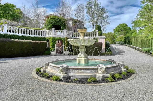 a kitchen with stainless steel appliances granite countertop a stove and cabinets