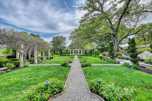 an aerial view of a house with a garden