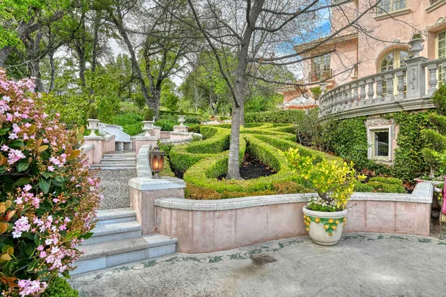 an aerial view of a house with yard swimming pool and outdoor seating