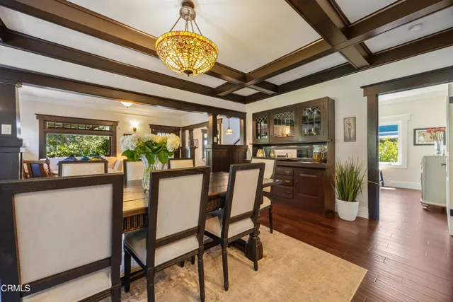 a view of a dining room with furniture window and wooden floor
