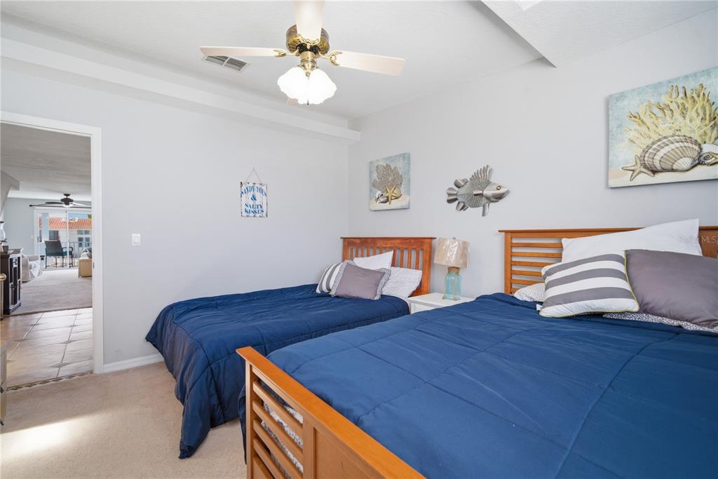 643 Garland Circle Indian Rocks Beach, FL 33785 - Photo 31 of 81 a bedroom with a bed and dresser