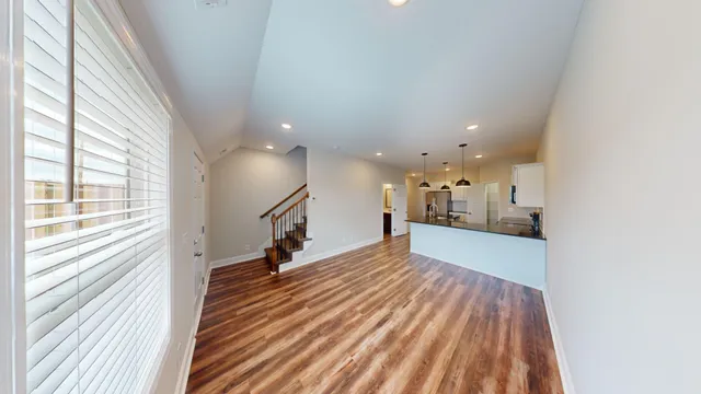 a view of a living room with a large window