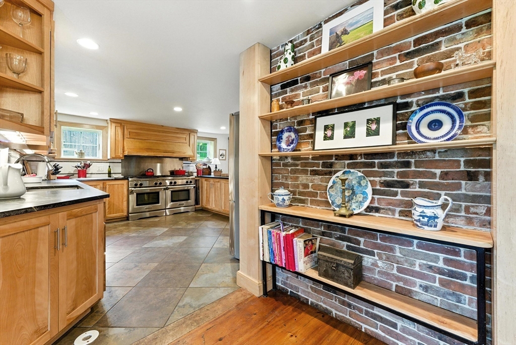 85 Dacey Road Conway, MA 01341 - Photo 12 of 42 a kitchen with stainless steel appliances granite countertop a stove and cabinets