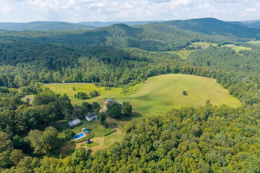 85 Dacey Road Conway, MA 01341 - Photo 2 of 42 an aerial view of mountain with residential house in background