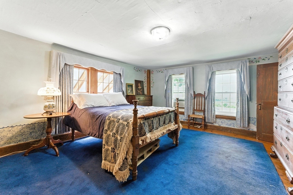 85 Dacey Road Conway, MA 01341 - Photo 27 of 42 a bedroom with a bed a window and a couch